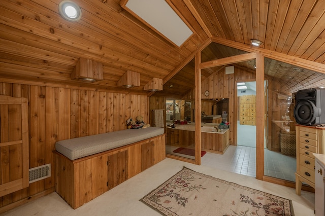 interior space with wood ceiling, wood walls, and lofted ceiling