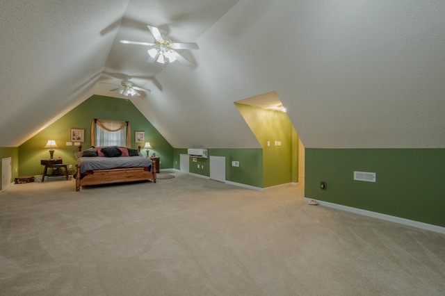 bedroom featuring vaulted ceiling, light carpet, a textured ceiling, and ceiling fan