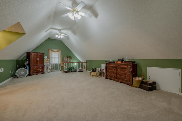 additional living space featuring vaulted ceiling, light carpet, and ceiling fan