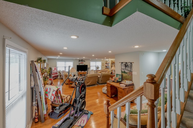 interior space with hardwood / wood-style floors and a textured ceiling