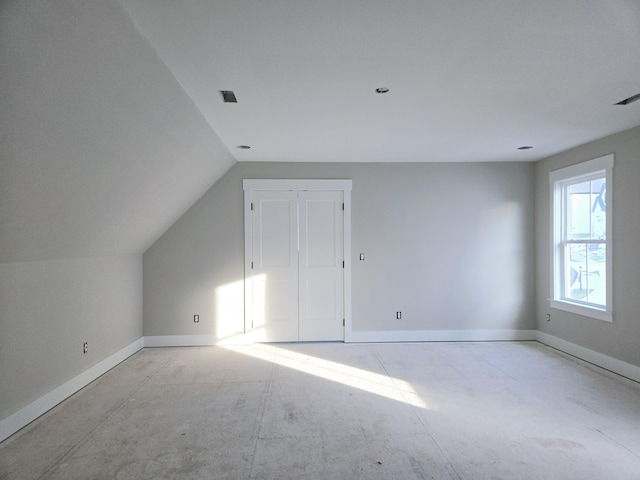 bonus room featuring vaulted ceiling