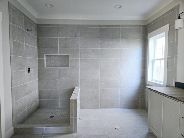 bathroom featuring tile patterned floors and tiled shower