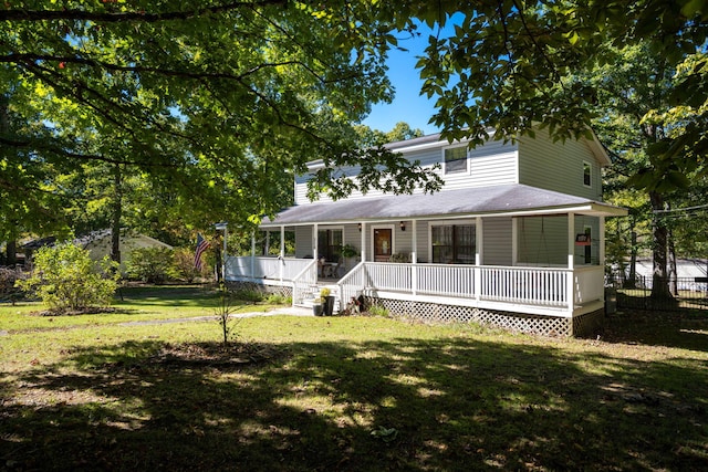 country-style home featuring a front lawn and a porch