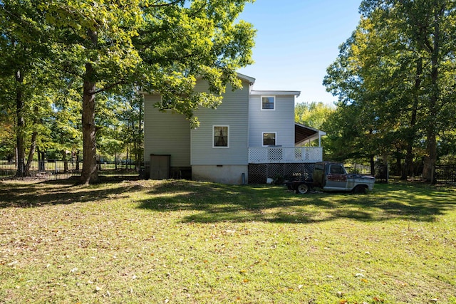 view of side of property with a yard