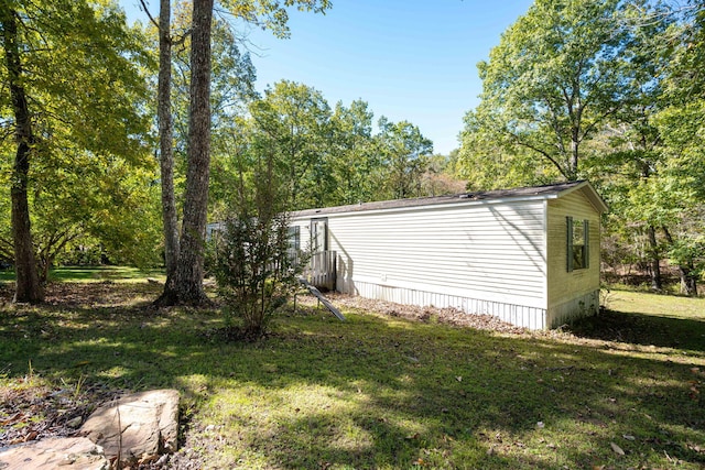 view of home's exterior with a lawn