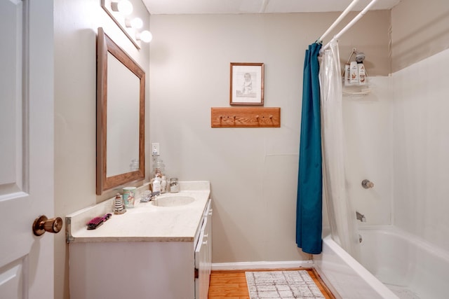 bathroom with vanity, hardwood / wood-style flooring, and shower / bath combo