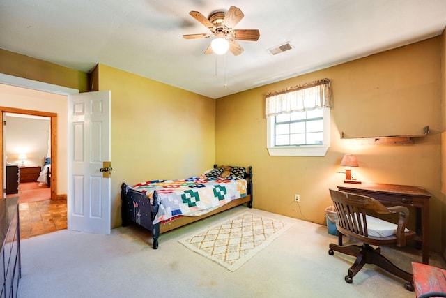 carpeted bedroom with ceiling fan