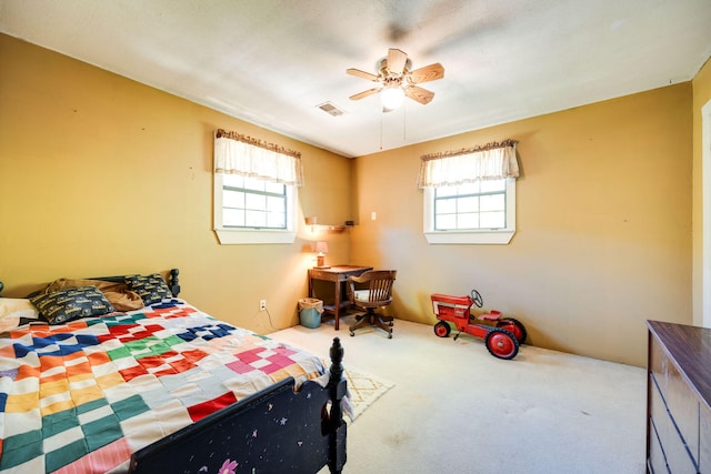 bedroom with multiple windows, carpet flooring, and ceiling fan