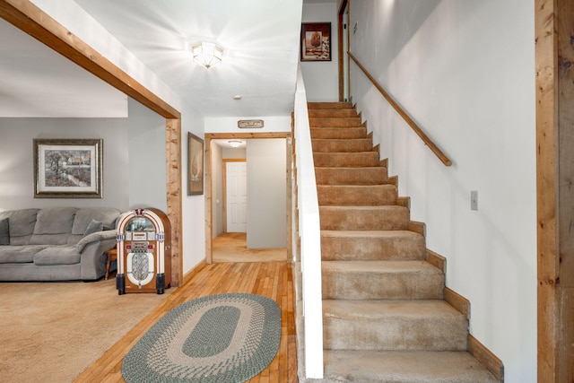 staircase featuring hardwood / wood-style flooring