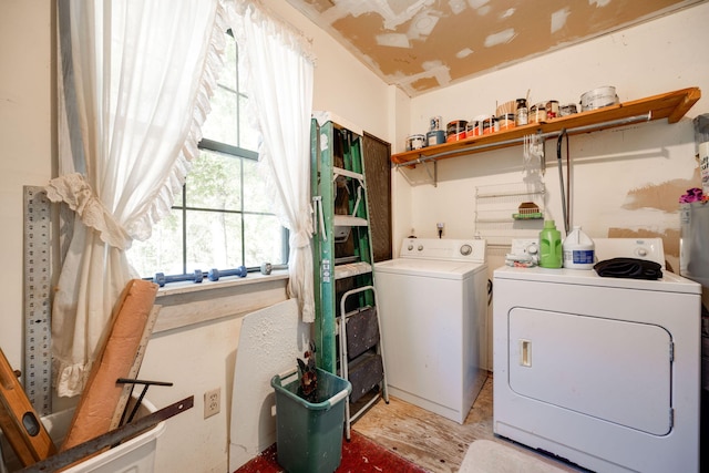 washroom with light wood-type flooring and separate washer and dryer