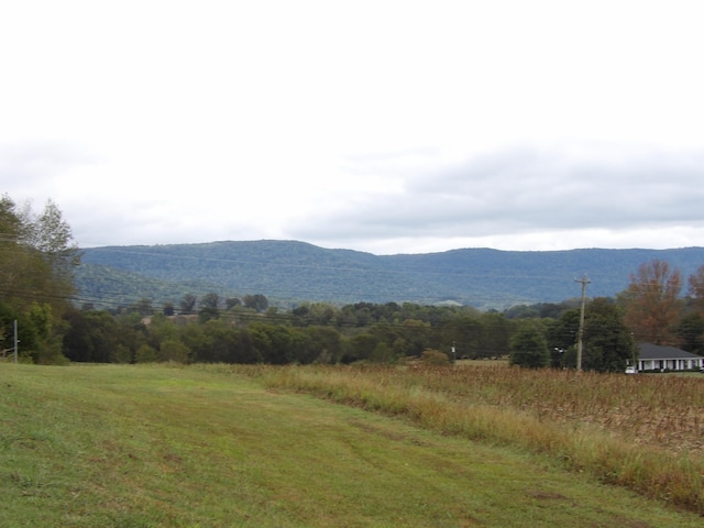 property view of mountains featuring a rural view