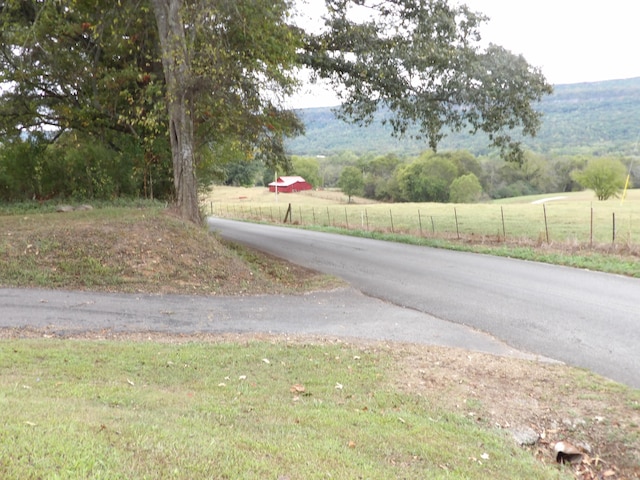 view of street featuring a rural view and a mountain view