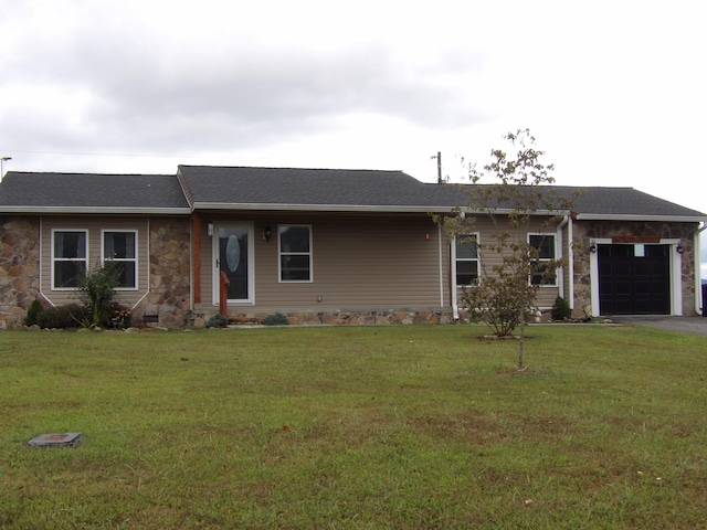 single story home featuring a garage and a front yard