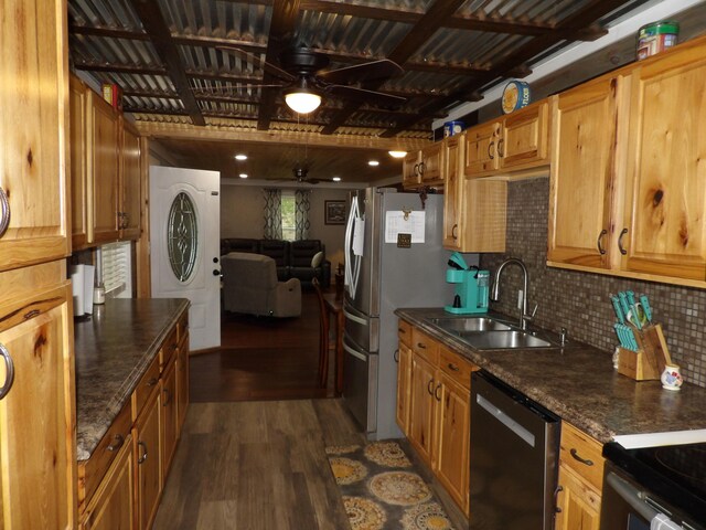 kitchen featuring ceiling fan, decorative backsplash, sink, dark wood-type flooring, and appliances with stainless steel finishes