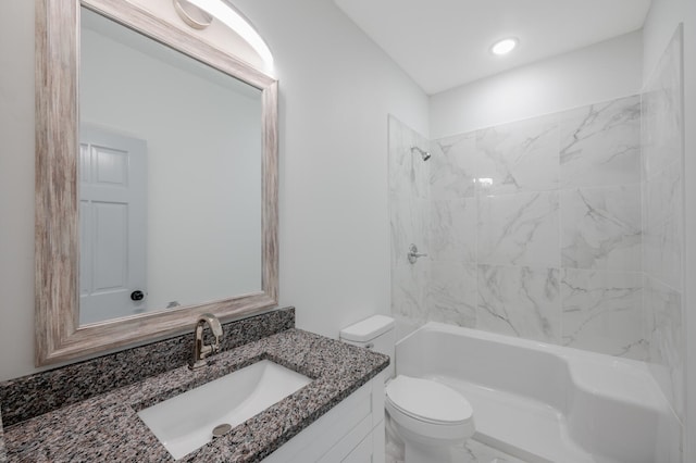 full bathroom with vanity, tiled shower / bath combo, and toilet