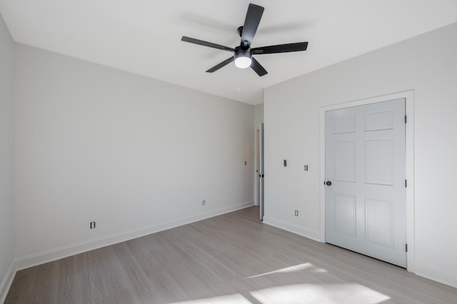 unfurnished bedroom with ceiling fan and light wood-type flooring