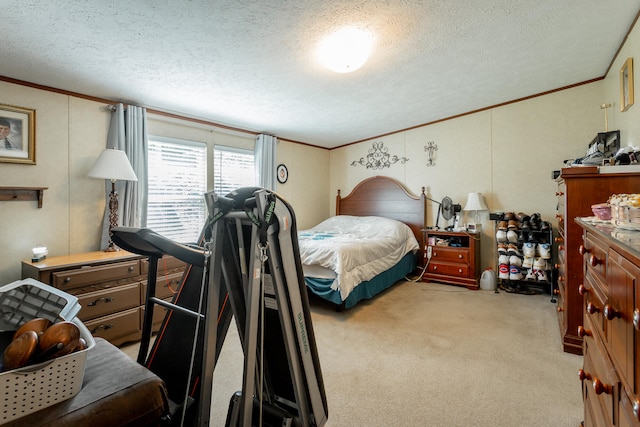 bedroom featuring light colored carpet, a textured ceiling, and crown molding