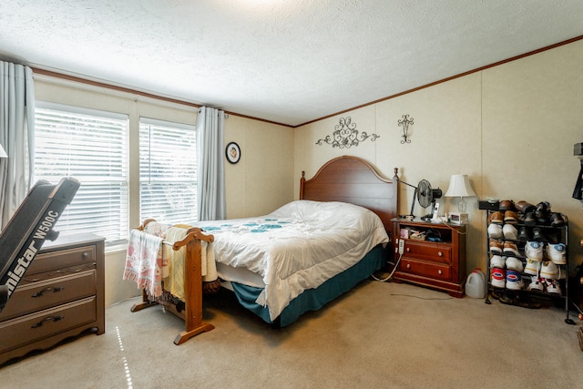 bedroom featuring crown molding, light colored carpet, and a textured ceiling