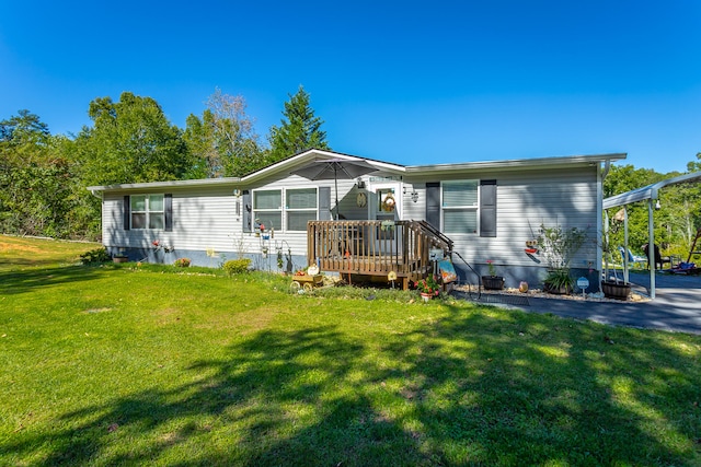 view of front of property featuring a deck and a front lawn