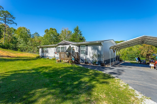 view of front of house featuring a carport and a front lawn