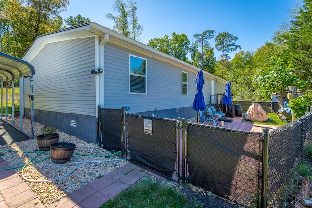 view of side of home with a patio area