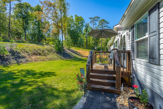 view of yard with a wooden deck