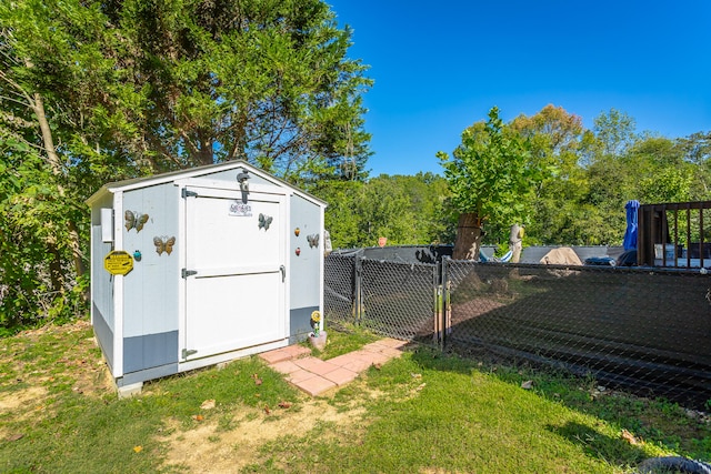 view of outbuilding featuring a yard