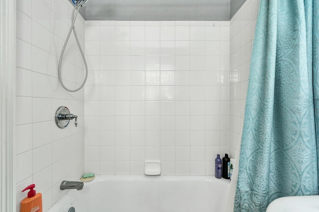 bathroom featuring shower / bath combo with shower curtain