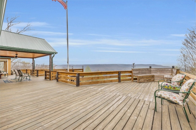 wooden deck with ceiling fan