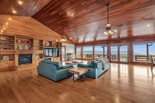 living room with wood-type flooring, plenty of natural light, and wood ceiling