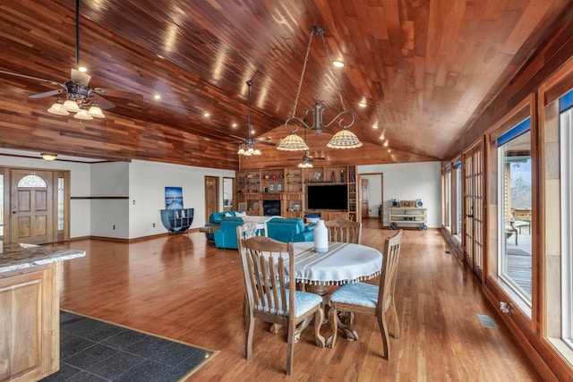 dining area with wood-type flooring, wood ceiling, vaulted ceiling, and ceiling fan