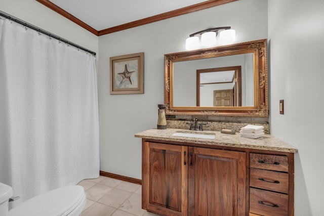 bathroom with vanity, crown molding, and toilet