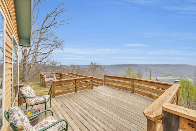 wooden terrace with a mountain view