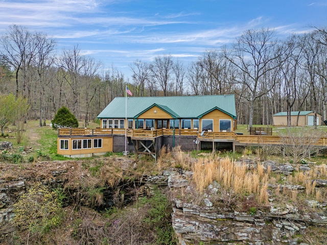 rear view of property with a deck