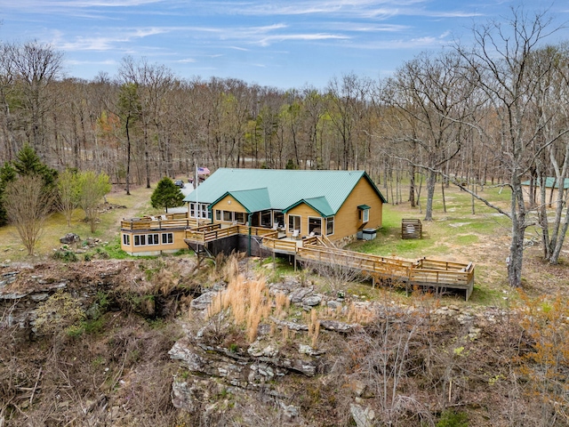 back of property featuring a wooden deck