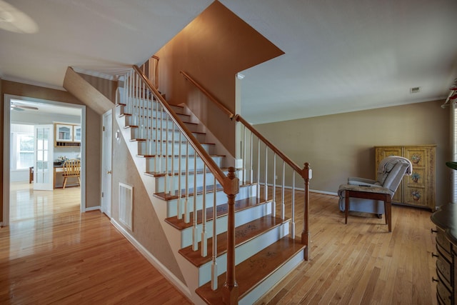 stairs with hardwood / wood-style floors