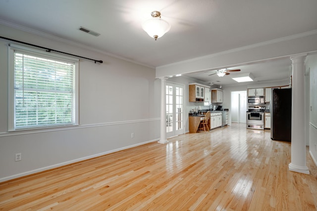 unfurnished living room with ceiling fan, light hardwood / wood-style flooring, ornamental molding, french doors, and sink