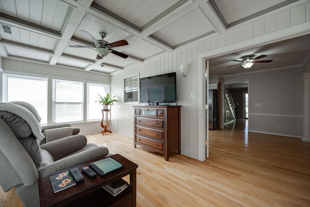 living room featuring light hardwood / wood-style floors, coffered ceiling, beamed ceiling, and ceiling fan