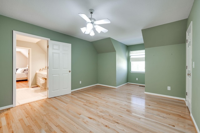 additional living space with ceiling fan, vaulted ceiling, and light hardwood / wood-style flooring