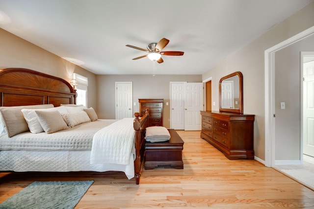 bedroom with light hardwood / wood-style flooring and ceiling fan