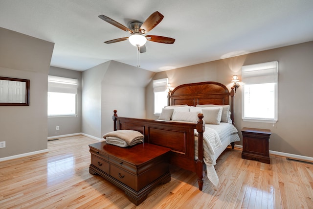 bedroom featuring visible vents, a ceiling fan, light wood-type flooring, and baseboards