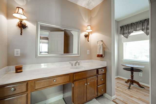 bathroom featuring vanity and wood-type flooring