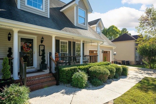 property entrance featuring a garage and a porch