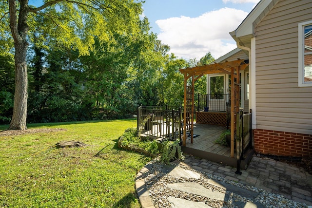 view of yard featuring a wooden deck