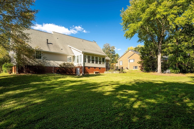 view of yard with a sunroom