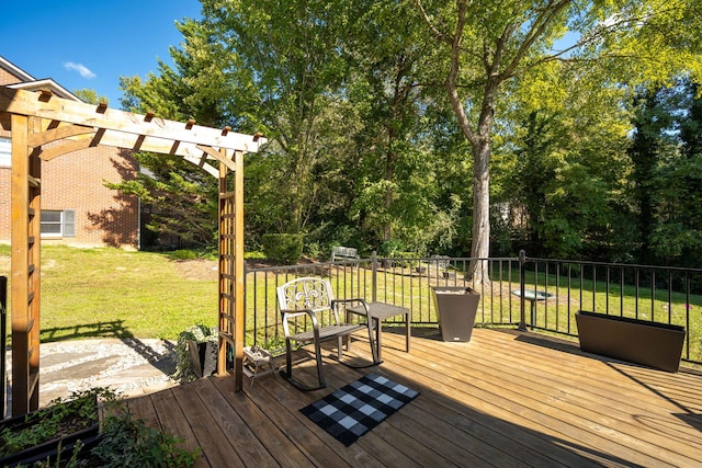 wooden terrace with a yard and a pergola