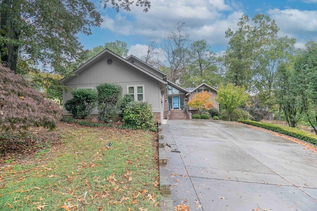 view of front of home featuring concrete driveway