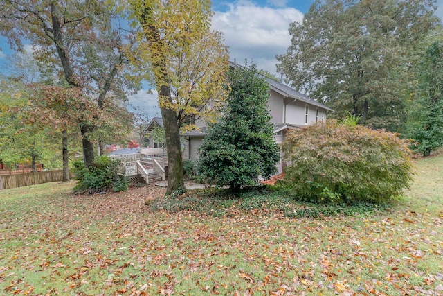 view of yard with fence and a deck
