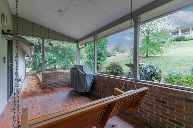 sunroom / solarium with lofted ceiling and plenty of natural light