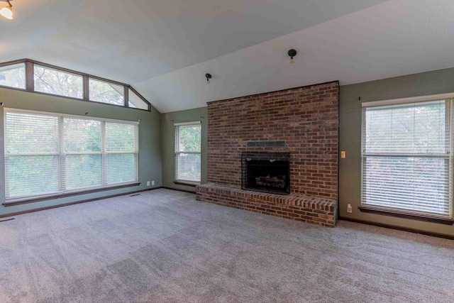 unfurnished living room featuring visible vents, carpet, a brick fireplace, and vaulted ceiling